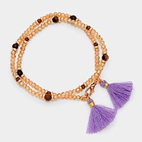 Beaded wrap stretch bracelet with double tassel charms
