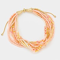 Multi-strand boho bead cinch bracelet