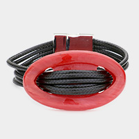 Celluloid hoop accented multi-tier cord bracelet